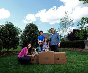 family with moving boxes